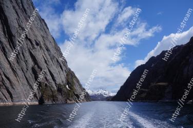 Sky, Fjord, Mountainous landforms, Natural landscape, Mountain, Sound, Highland, Cliff, Sea, Rock 