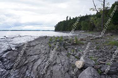 Shore, Rock, Coast, Water, Natural environment, Sea, Wilderness, Coastal and oceanic landforms, Bedrock, Raised beach 
