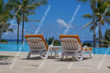 Outdoor furniture, Furniture, Vacation, Tree, Sunlounger, Beach, Property, Caribbean, Tropics, Leisure 