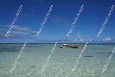 Body of water, Sea, Sky, Ocean, Beach, Boat, Water, Tropics, Vehicle, Coastal and oceanic landforms 