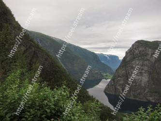 Mountainous landforms, Highland, Mountain, Fjord, Natural landscape, Wilderness, Valley, Sky, Cliff, Water Aurland